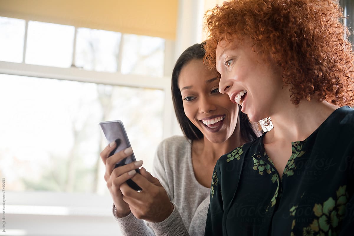 Women Looking at Phone Loyalty App